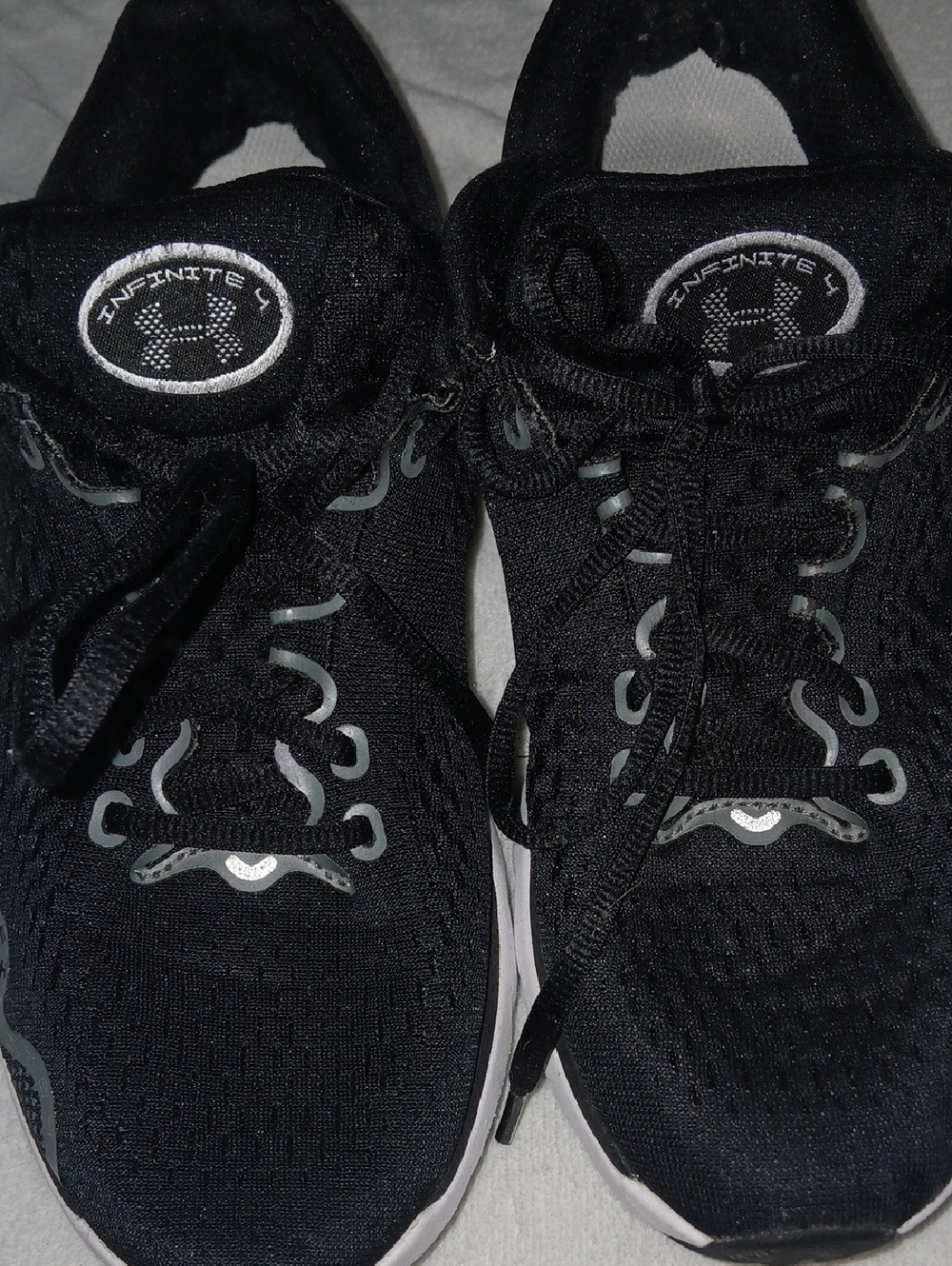 Under Armour Black Athletic Running Shoes with Silver Accents